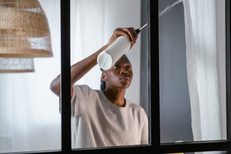 man cleaning window