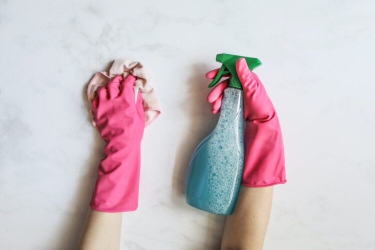 hands with gloves and spray